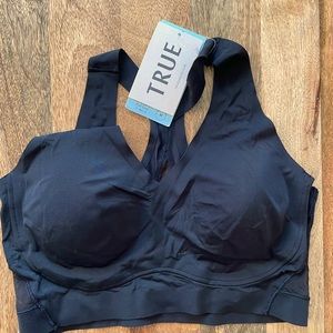 True and co black racer back sports bra with mesh.